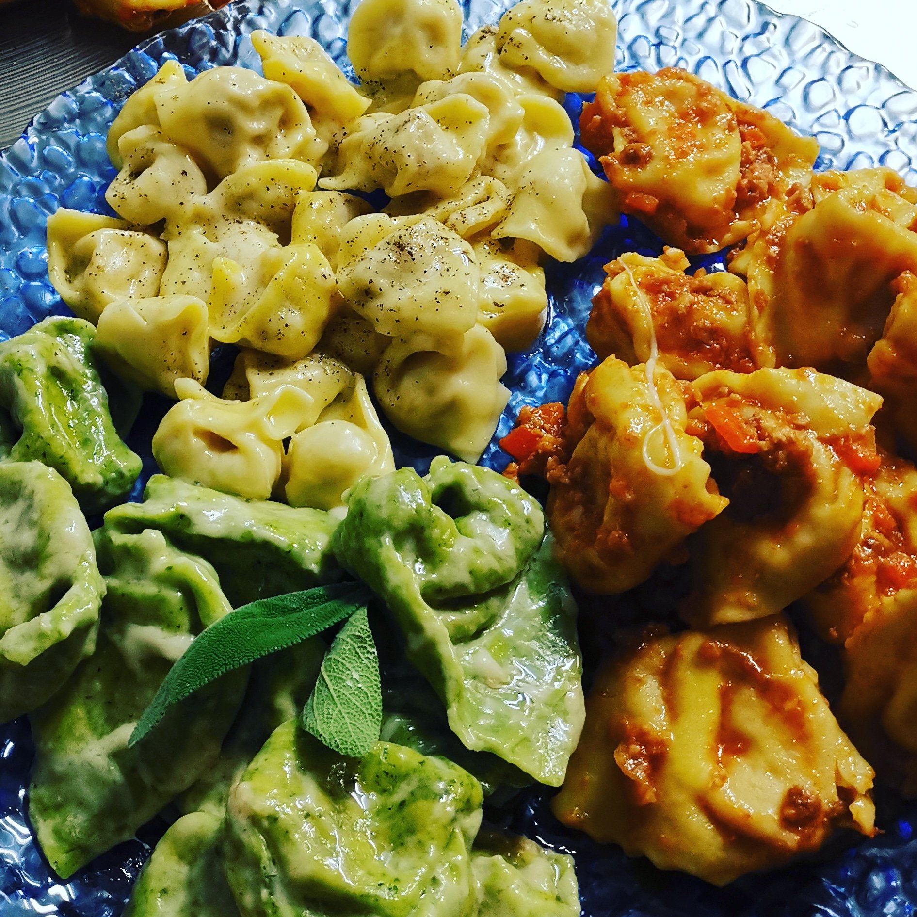 tris di cappelletti pecorino, pepe e burro, cappellacci di zucca al ragù, cappellacci di pere e formaggio saltati con burro e salvia